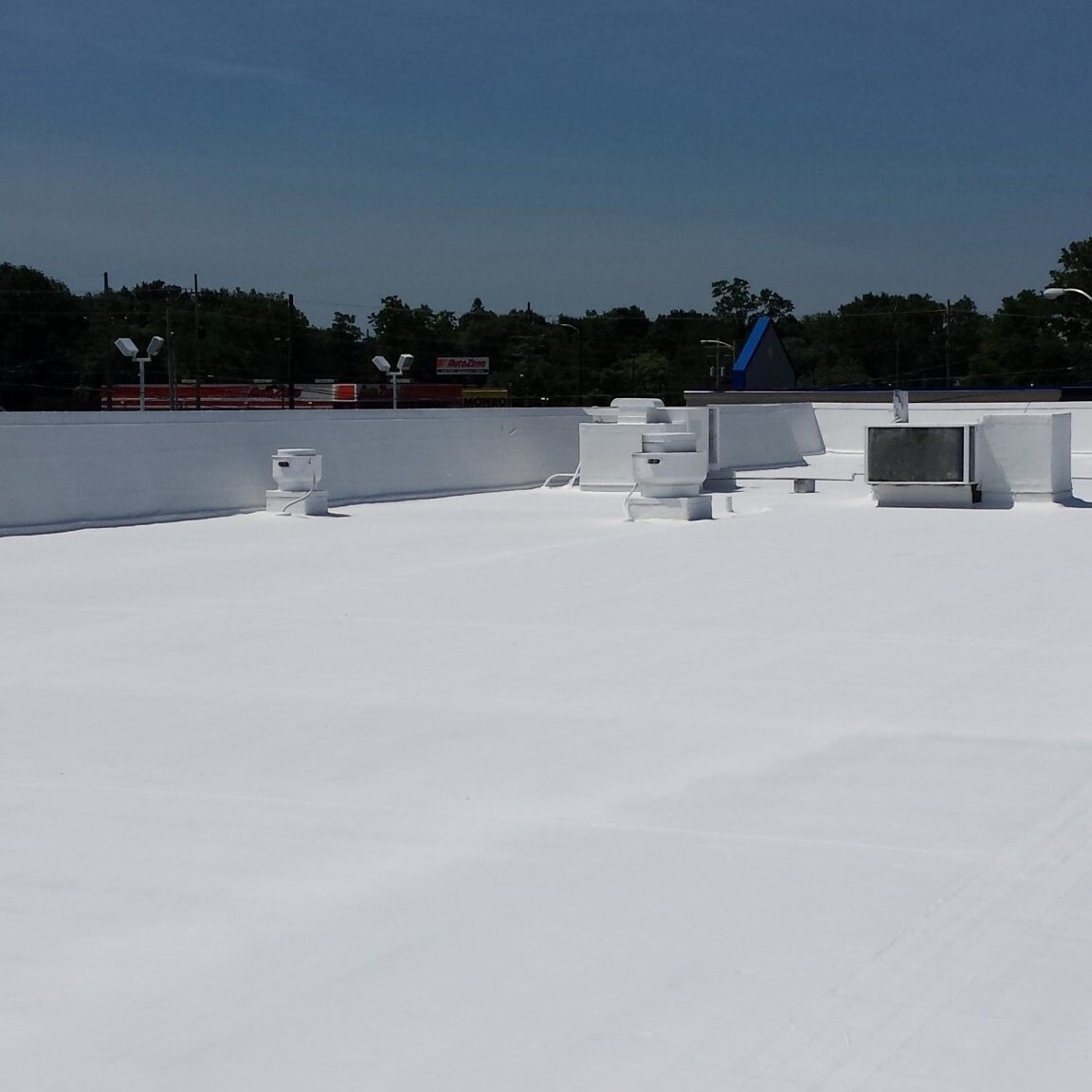Conklin Single-ply roofing system installation Houston commercial building