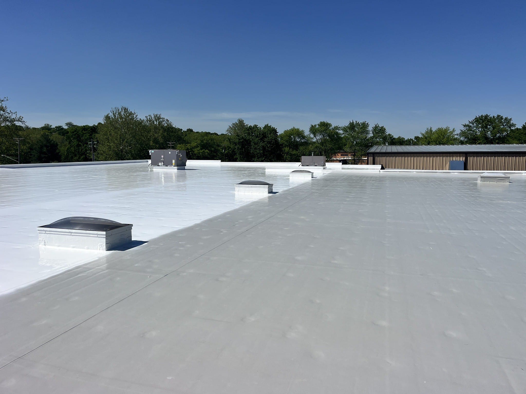 Membrane coating with affinity top coat commercial facility