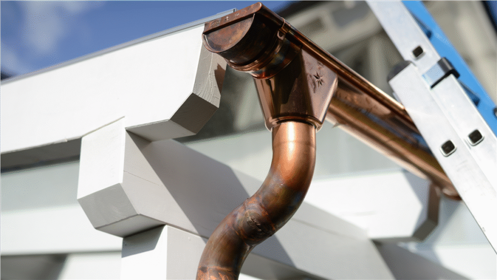 Elegant copper gutters installed on a luxury house, showcasing durability and aesthetic appeal